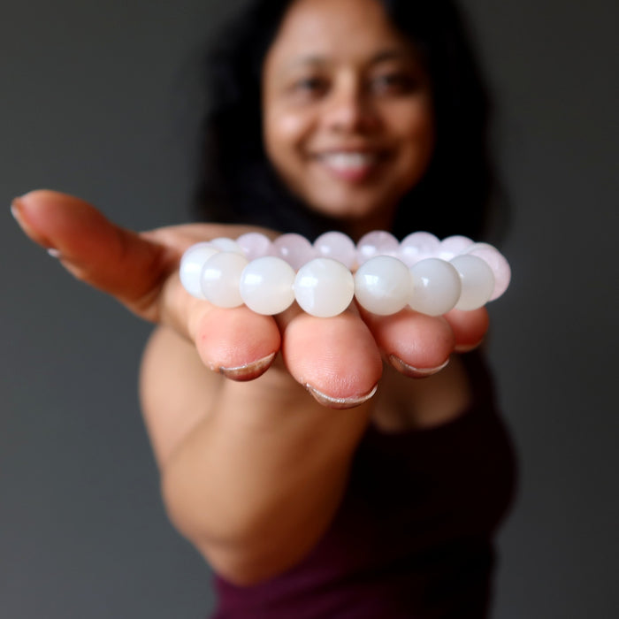 sheila of satin crystals showing a white moonstone and pink rose quartz round beaded stretch bracelet