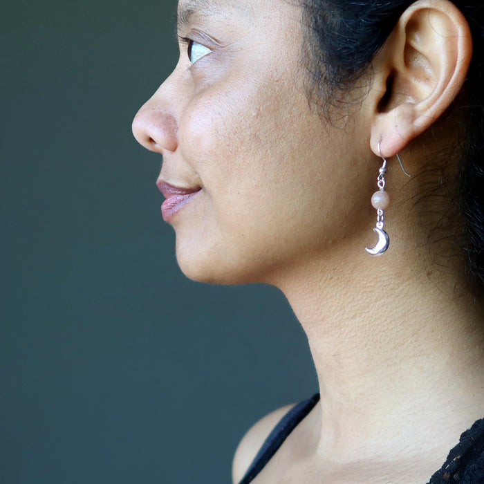 sheila of satin crystals wearing peach moonstone sterling silver crescent moon dangle earrings
