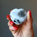 hand holding moonstone tourmaline heart