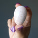 hand holding Cream Moonstone Egg 