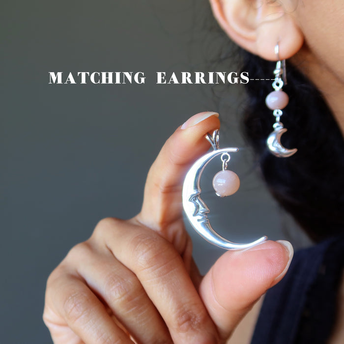showing matching earrings with a sterling silver smiling crescent moon pendant hanging with peach moonstone