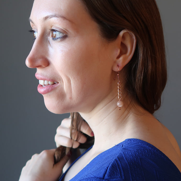 holly of satin crystals wearing pink moonstone copper chain earrings