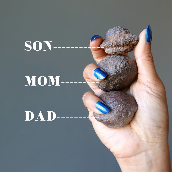 two male and one female moqui marble stones in varying sizes indicating son, mom, dad