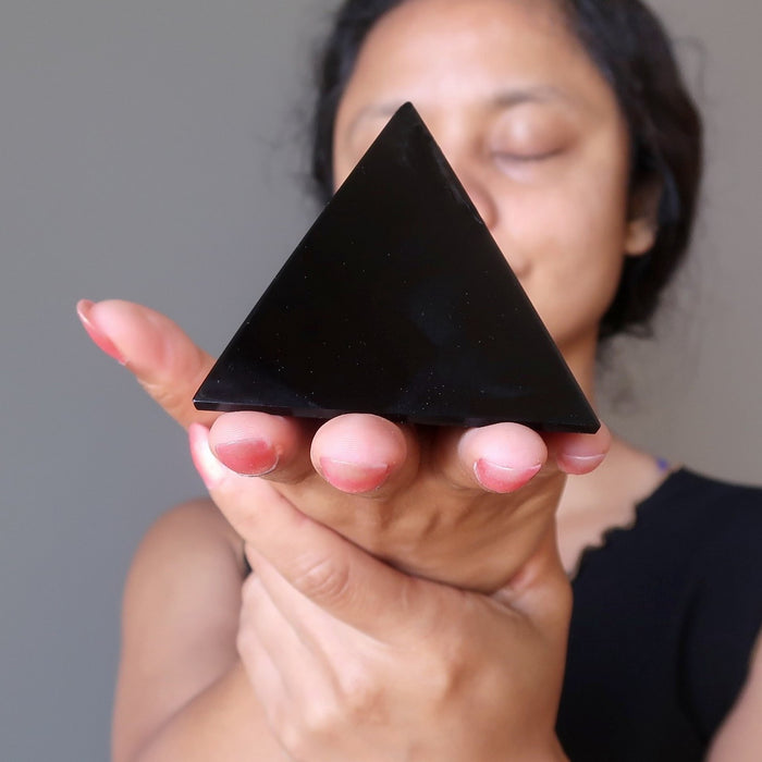 sheila of satin crystals meditating with black obsidian pyramid
