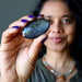 sheila holding oval Silver Sheen Obsidian cabochon