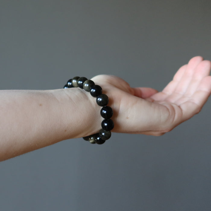 model wearing Gold Sheen Obsidian Bracelet