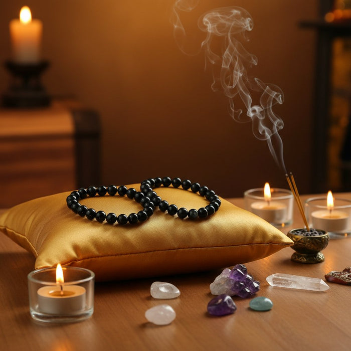 model wearing Gold Sheen Obsidian Bracelets on both wrists