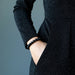 model hand in jean pocket wearing model wearing Gold Sheen Obsidian Bracelet