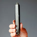 hand holding Faceted Gold Sheen Obsidian Wand