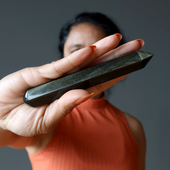 sheila of satin crystals holding Faceted Gold Sheen Obsidian Wand