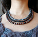 woman wearing triple strand obsidian necklace