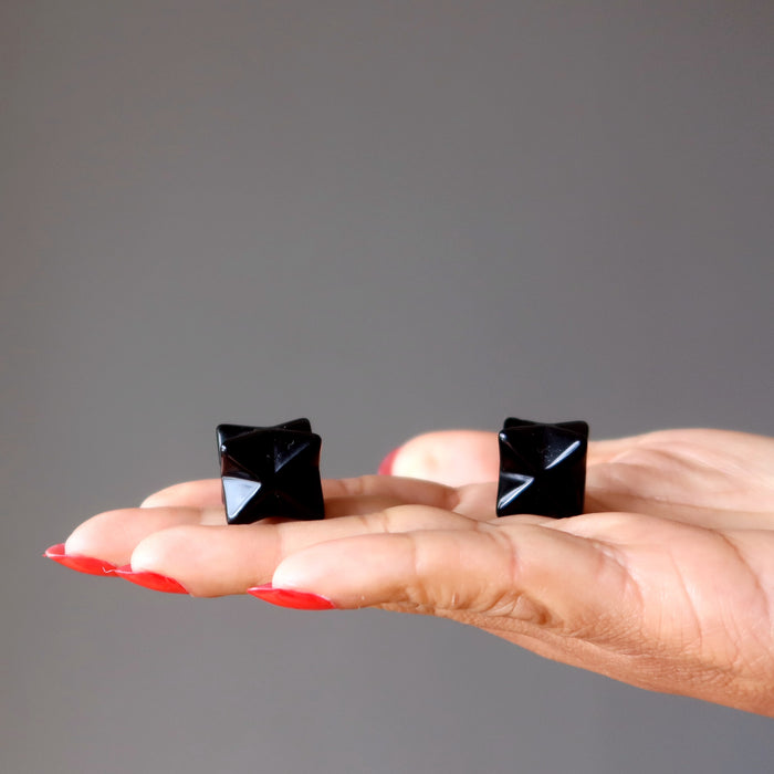 black obsidian merkabas in hand