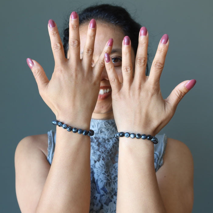 sheila of satin crystals modeling black and white onyx stretch bracelets