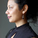 sheila of satin crystals wearing onyx earrings