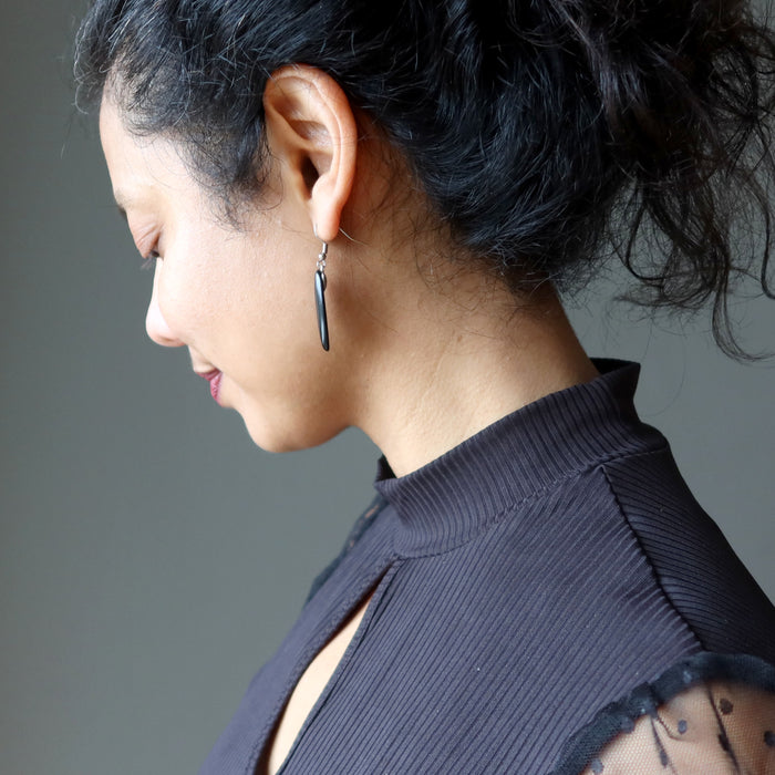 female wearing black onyx oval earrings