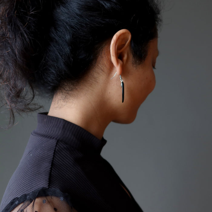 female wearing black onyx oval earrings