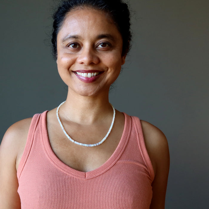 woman wearing opal necklace