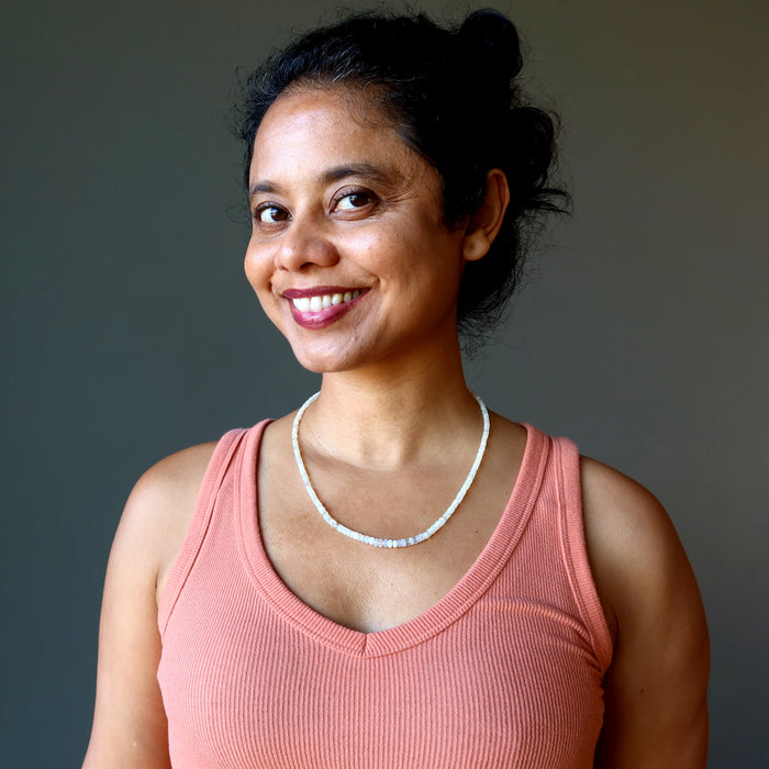 woman wearing opal necklace