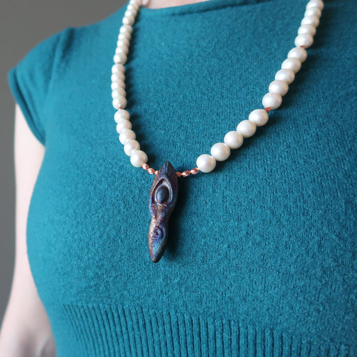 woman modeling pearl goddess necklace
