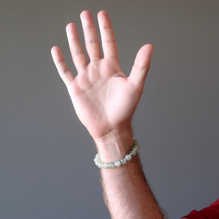 round beaded green prehnite bracelet on a male hand model