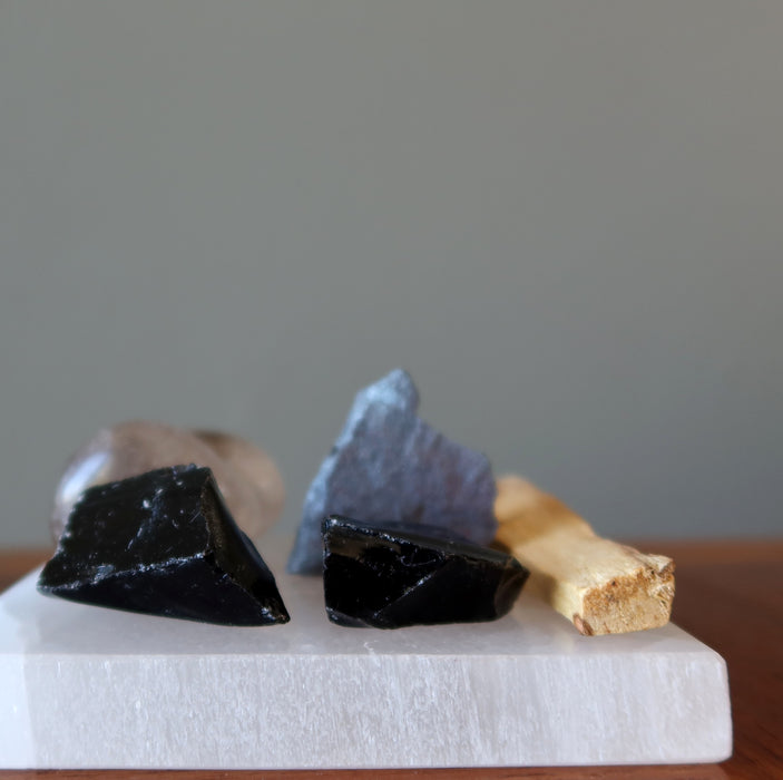obsidian, hematite, smoky quartz, selenite slab, palo santo