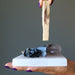 protection stones on selenite slab with palo santo