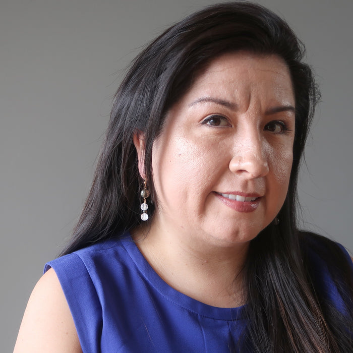valerie of satin crystals wearing faceted pyrite and white selenite dangle earrings
