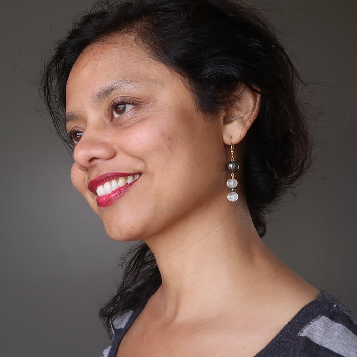 sheila  of satin crystals wearing faceted pyrite and white selenite dangle earrings