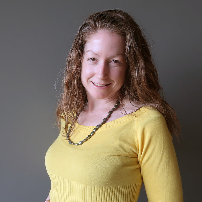 woman wearing pyrite oval necklace