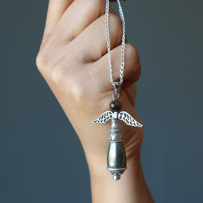 hand holding pyrite tigers eye angel necklace