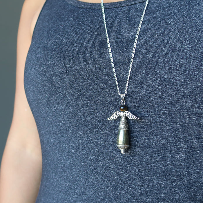 female wearing pyrite tigers eye angel necklace