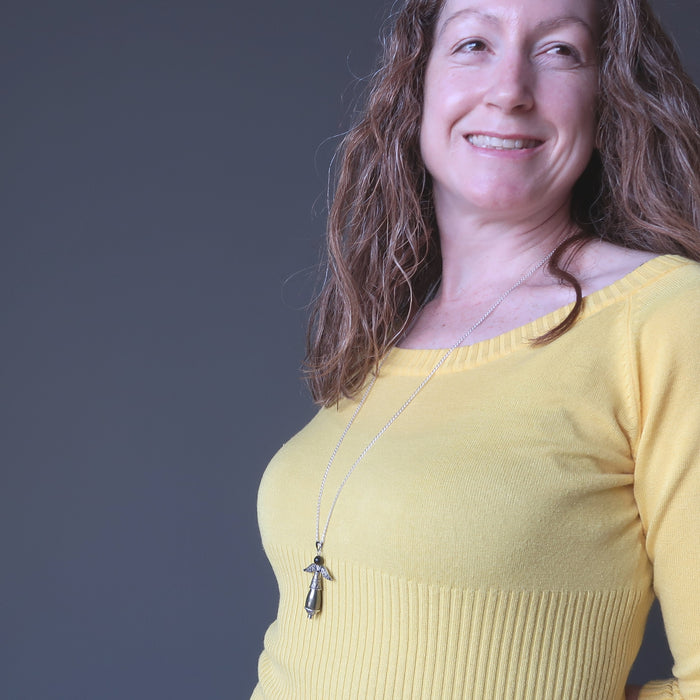 female wearing pyrite tigers eye angel necklace