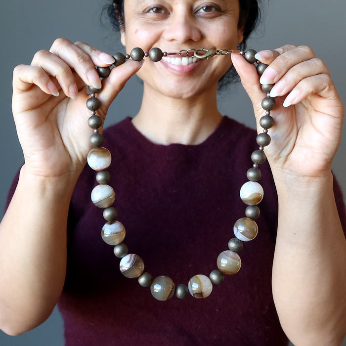 sheila holding Snow Quartz Brown Agate Necklace