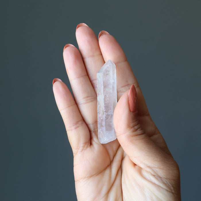 hand holding Aura Quartz Point Wand