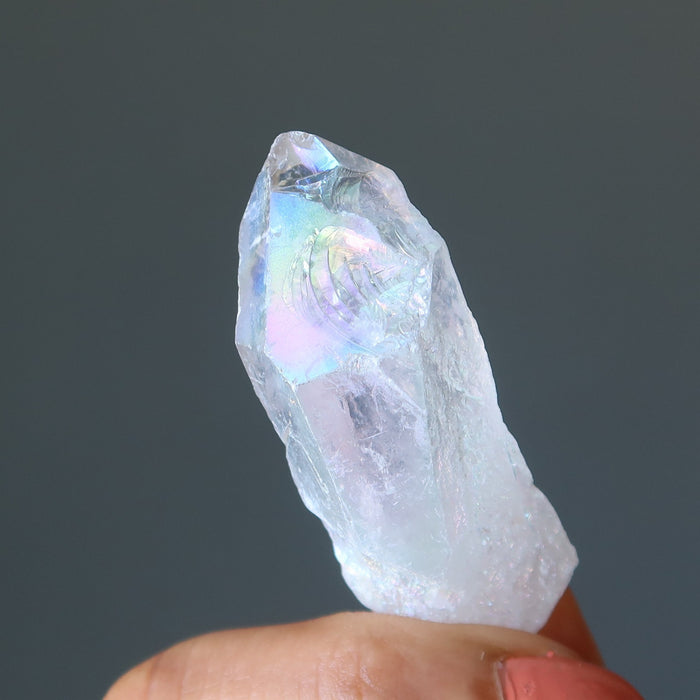 hand holding Aura Quartz Point Wand