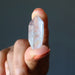 hand holding Aura Quartz Point Wand