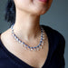 A clear quartz and blue aventurine necklace with a silver clasp.