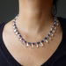 A clear quartz and blue aventurine necklace with a silver clasp.