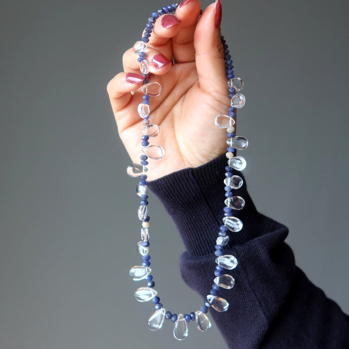 A clear quartz and blue aventurine necklace with a silver clasp.