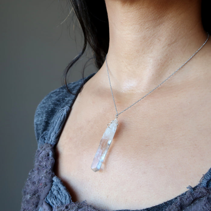 raw clear quarz point necklace on female model