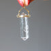hand holding clear quartz double terminated pendant