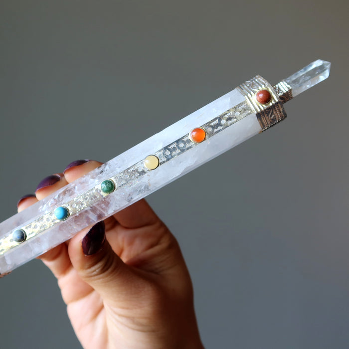 holding Clear Quartz Chakra Wand