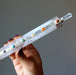 holding Clear Quartz Chakra Wand