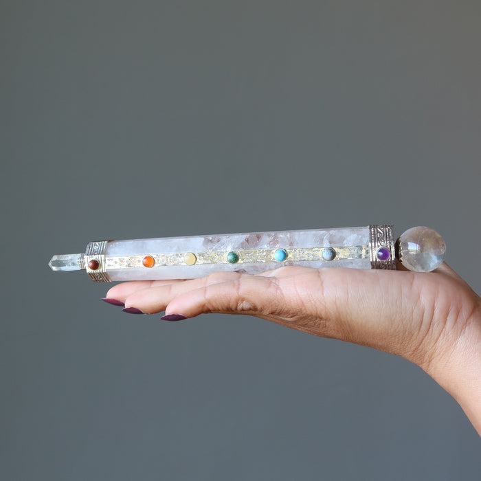 displaying Clear Quartz Chakra Wand on the palm