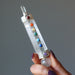 holding Clear Quartz Chakra Wand