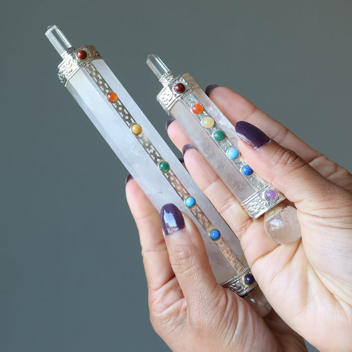 holding two different sized wands