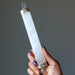 holding a Clear Quartz Chakra Wand