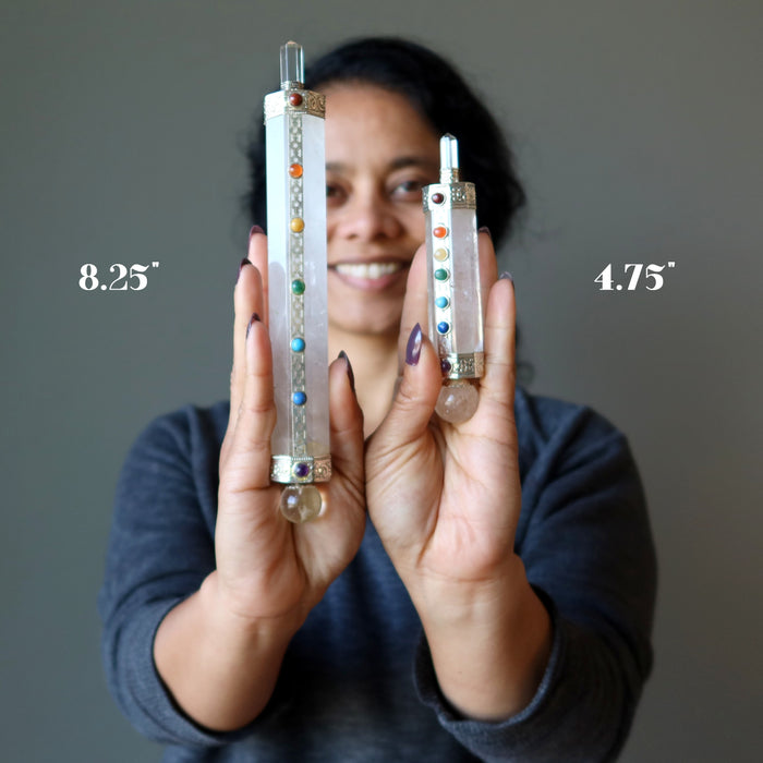 sheila of satin crystals holding 4.75" and 8.25" Clear Quartz Chakra Wand on each hand