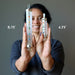 sheila of satin crystals holding 4.75" and 8.25" Clear Quartz Chakra Wand on each hand