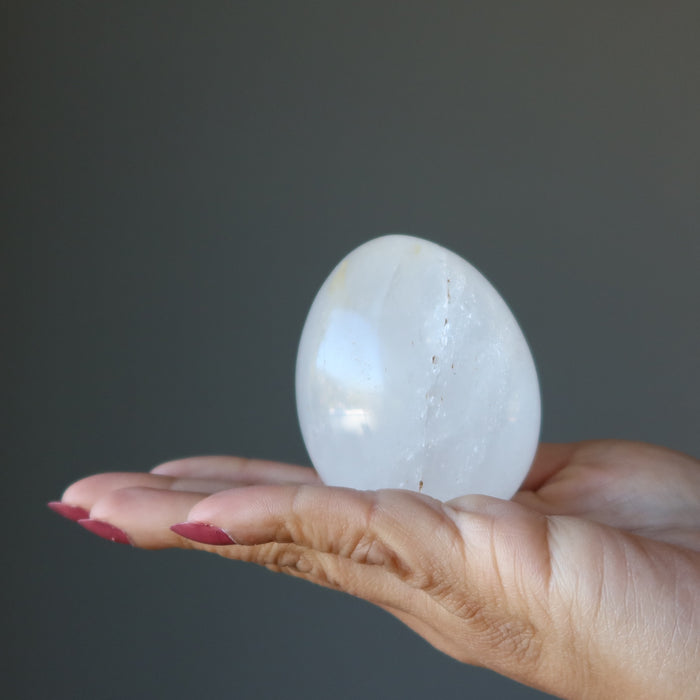 palm holding Cloud Quartz Egg 